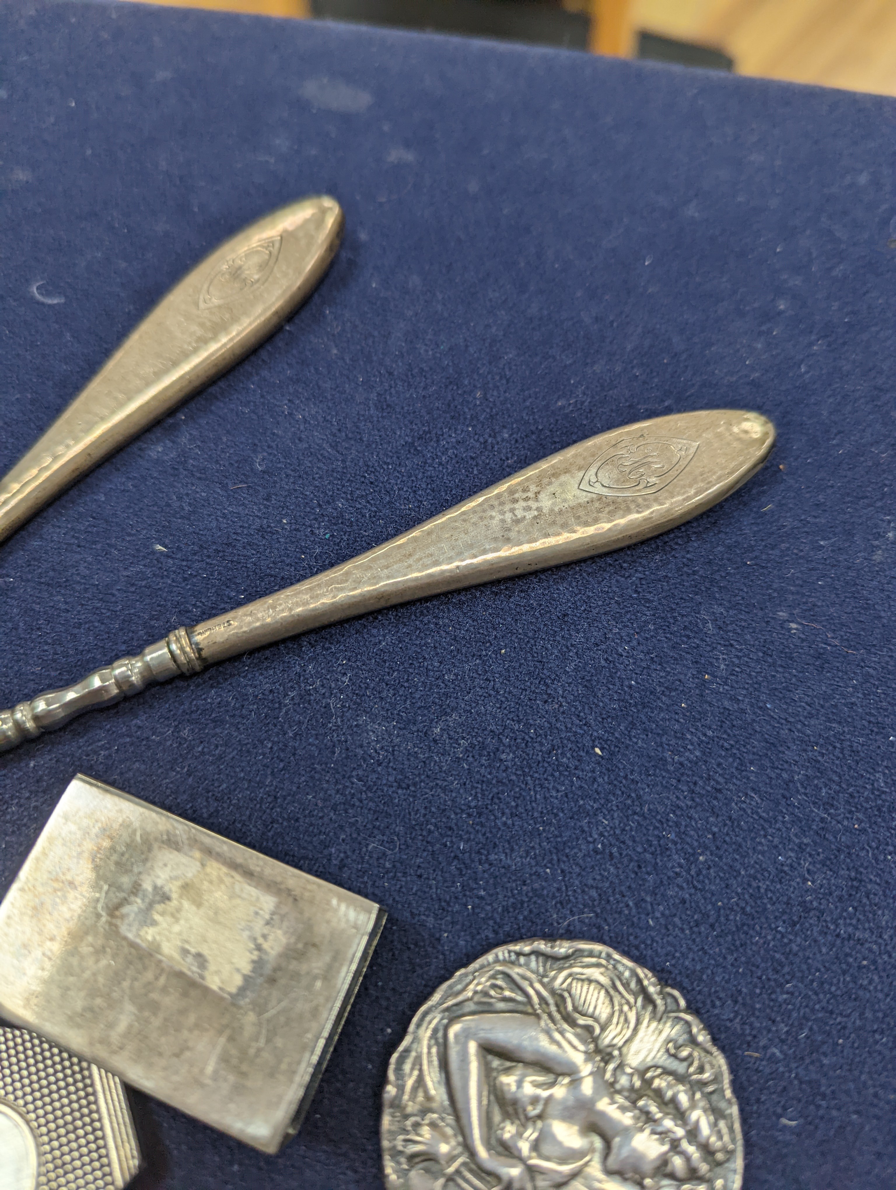 A cased Victorian engraved gilt white metal and coral set double ended scent bottle, 13.4cm, a silver cigar cutter, a belt, a silver buckle, gilt and cranberry perfume bottle, etc.